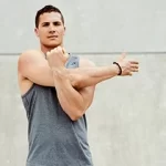 Cross-body reach shoulder stretch exercise