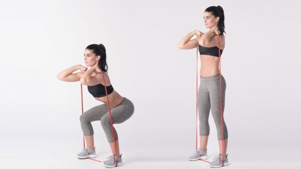 Resistance band squatting exercise