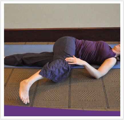 Lying Knee Twist to stretch paraspinal muscle