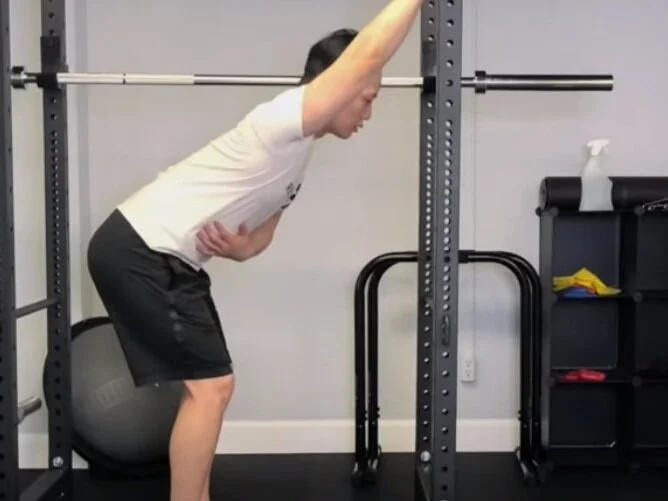 PNF wall-assisted latissimus dorsi stretch
