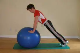 Swiss ball push-up plus or stability ball pushup plus