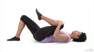 pose with knee to chest